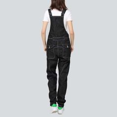 Make a statement with our 90s-style. Black Denim Women's Overall from the 2023 Autumn Collection! Crafted with premium quality denim for ultimate comfort and durability. this monochrome piece is sure to give your wardrobe a grunge-inspired twist. With its loose fit. distressed pattern. and duo of suspenders and buttons closure. you can take your style to the next level!Why These Overalls are a Must-Have: Grunge Aesthetic: Radiate an effortlessly cool attitude with these on-trend overalls. Distin Casual Black Cotton Denim Jumpsuit, Black Cotton Casual Denim Jumpsuit, Casual Black Baggy Overalls, Black Denim Utility Jumpsuit, Black Utility Denim Jumpsuit, Black Denim Jumpsuit In Utility Style, Black Overalls With Pockets For Streetwear, Casual Washed Black Cotton Overalls, Black Cotton Overalls Jeans