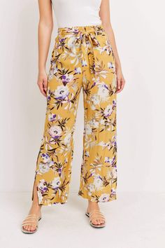 Color: Floral Print Detail Material: 100% Rayon Season: Spring/Summer Wide Leg Self Tie Waist Side Pockets Cut Out Side With Button Closure Full Length Model Is Wearing Small Height : 5' 8" Bust : 31.5" Waist : 24" Hips : 35" Casual Split Pants For Spring, Yellow Floral Print Vacation Pants, Vacation Bottoms With Floral Print And Split Design, Summer Floral Print Split Bottoms, Split Bottoms For Summer Brunch, Floral Print Split Bottoms For Beach, Summer Split Bottoms For Brunch, Floral Print Split Beach Bottoms, Casual Split Floral Print Bottoms