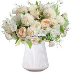 a white vase filled with lots of flowers