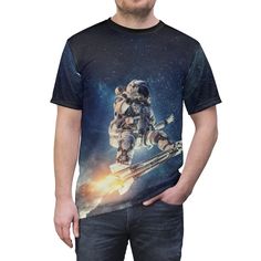 "AOP tee -- \"Surfing with the aliens\" -- Astronaut tee * Uniquely textured, microfiber knit fabric wicks perspiration away from the skin, drawing it to the surface where it evaporates. * 100% Polyester * Light fabric (4.0 oz/yd² (113 g/m / (6.0 oz/yd² (170 g/m * Regular fit * Tagless * Runs true to size Image by [Sergey Nivens / Shutterstock] See more of our stuff! Visit http://morecowbellstore.com/" Fitted Graphic Tee With Sublimation Print, Space-themed Cotton T-shirt With Graphic Print, Space-themed Graphic Print Cotton T-shirt, Fitted Crew Neck Shirt With Sublimation Print, Relaxed Fit Crew Neck Shirt With Character Print, Space-themed Graphic Crew Neck Tops, Space-themed Short Sleeve Top With Graphic Print, Space-themed Graphic Print Short Sleeve Tops, Casual Fitted Printed Sublimation Design