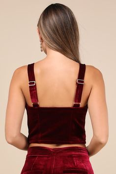 Keep things sultry-chic all night long in the Blank NYC Sneak Peak Burgundy Velvet Bustier Crop Top! Soft, plush velvet shapes this party-ready top with wide adjustable straps and a sweetheart neckline. Fitted, bustier-inspired bodice features seamed cups and flattering stitching before ending at an ultra-cropped hem. Hidden side zipper. Pair with the matching pants for a complete look! Fit: This garment fits true to size. Length: Size medium measures 9.75" from adjustable straps to hem. Bust: Works best for A to C cup sizes - consider sizing up for fuller bust. Waist: Fitted - very fitted at natural waist. Undergarments: May be worn with a strapless bra, adhesive bra, petals, or no bra. Fabric: Fabric has no stretch. Lined. Shell: 95% Polyester, 5% Spandex. Lining: 97% Polyester, 3% Spand Velvet Bustier, Burgundy Velvet, Adhesive Bra, C Cup, Matching Pants, Sneak Peak, Blank Nyc, Strapless Bra, Sweetheart Neckline