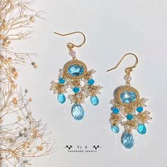 ♢ FEATURES & MATERIALS ~Topaz:natural colour,8*10mm,6*10mm,7ct*2 ~Pearl:natural colour, 2-3.5mm ~Apatite: natural colour,2-4mm，4*6mm ~Materials: 14K gold filled Topaz is November gemstone. I can't wait to recommend these gorgeous earrings to you, they are my favorite gemstone earrings! I used 14ct high quality sky bule topaz and paired them with apatite and pearl mini beads, they sparkled in the sunlight and were so charming!It is suitable for weddings, parties and banquet. All metals are filled Luxury Topaz Earrings For Wedding, Handmade Chandelier Earrings For Anniversary, Handmade Round Chandelier Earrings For Anniversary, Handmade Elegant Aquamarine Earrings, Blue Briolette Earrings For Wedding, Handmade Blue Topaz Wedding Jewelry, Handmade Topaz Jewelry For Wedding, Luxury Handmade Chandelier Earrings For Weddings, November Gemstone