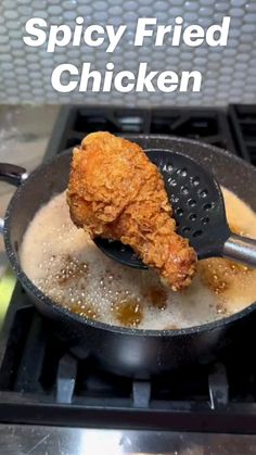 a fried chicken is being cooked in a skillet