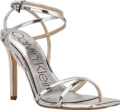 Chic Silver Sandals For Spring, Modern Sandals For Spring Party, Modern Spring Party Sandals, Spring Silver Strappy Sandals, Silver Strappy Sandals For Spring, Spring Cocktail Trendy Sandals, Trendy Calvin Klein Sandals For Spring, Spring Cocktail Sandals, Calvin Klein Summer Party Sandals