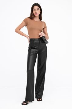 A force of nature in stretchy faux leather with a high-sheen finish, our Julien Pants offer a luxurious feel and an illuminating dimension to any look. Thoughtfully constructed for seasonless wear, she features a wide-leg, high-rise cut and a distinctive horizontal seam at the knees. Julien is designed to evoke a surge of confidence wherever and whenever you wear her. Also available in latte. | Rocio is 5'9.5" (175 cm) tall, wearing size XS. Total length from below the waist is approximately 42. Force Of Nature, Tunic Hoodie, A Force, Sweatshirt Fabric, The A Team, Women Supporting Women, Pants Outfit, First Look, Black Pants