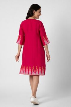 Hot pink dress with neon stuf embellishment in NY pattern on border. - Aza Fashions Festive Straight Kurta Dress With Embroidered Neckline, Resham Embroidery Midi Dresses, Pink V-neck Dress With Resham Embroidery, Fitted Dresses With Resham Embroidery, Festive Knee-length Embroidered Dress, Festive Pink Kurta With Embroidered Neckline, Fitted Pink V-neck Embroidered Dress, Festive Pink Midi Dress, Pink Fitted V-neck Embroidered Dress