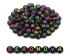 black beads with multicolored letters spelling the word bead - n - o - va