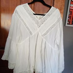 This Beautiful Flowing Beauty Is Chic And Charming. It Is A Perfect Addition To Your Wardrobe With A Sweater In Cold Months Or Just As For Summer! Flowy Cotton Tops With Lace Trim, Cotton V-neck Blouse With Lace Top, Cotton Lace Top V-neck Blouse, Flowy Lace Trim Tops For Daywear, Long Sleeve Tops With Lace Trim For Day Out, Long Sleeve Lace Beach Blouse, Spring Tunic Tops For Brunch, Long Sleeve Tops With Lace Trim For Vacation, Flowy Tunic Tops For Daywear