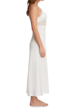 - Bouquet Collection- Dreamy long gown in stylish fan-patterned stretch lace and soft jersey- Sesmed lace cups with jersey lining- Unlined lace midriff- Flared A-line jersey skirt with coverstitch hem- Venise lace appliqué at front straps- Adjustable x-back straps with rose gold-colored hardware- Ankle length (approximately 54 inches from shoulder to hem)- Silk WhiteFabricationLace: 84% Nylon 16% Spandex; Mesh: 89% Nylon 11% Spandex; Tulle: 100% Nylon; Lining 100% Supima® Cotton; exclusive of tr Elegant Fitted Maxi Dress With Contrast Lace, Fitted Lace Maxi Dress With Lace Bodice, Fitted Lace Bodice Maxi Length Dress, Fitted Lace Dress With Maxi Length Bodice, Fitted Bodice Maxi Dress With Lace Back, Evening Lace Stretch Maxi Dress, Elegant Stretch Maxi Dress With Lace Trim, Stretch Lace Maxi Dress For Evening, Fitted Contrast Lace Dress For Wedding Night