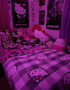 a bedroom with hello kitty bedspreads and pictures on the wall