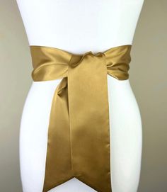 "Wide Antique Gold Satin Sash  Dark Gold Sash Belt  Gold Wrap Belt  Deep Gold Wedding Sash  Bridal Sash Gold Satin Bow Belt  Satin Swank  This Satin Swank® reversible waist sash is the perfect finishing touch for your bridesmaid, wedding, or special occasion dress, or just the right piece to add instant polish to your dress or top. Depending on your waist size and the length you choose (60, 75, and 90 inch lengths available), you can wrap the sash around your waist once or twice. You decide whet Wedding Sash With Tie Back, Satin Wedding Sash, Wedding Belts With Sashes, Satin Sashes For Bridesmaids, Formal Fitted Sash With Tie Waist, Satin Bridal Belt For Bridesmaids, Formal Sashes With Matching Belt, Elegant Fitted Tie Waist Sash, Gold Sash Belts For Formal Occasions