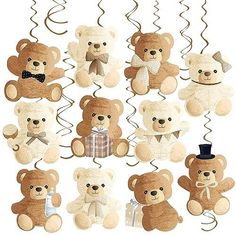 a bunch of stuffed teddy bears hanging on a string with a top hat and bow tie