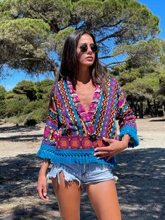 An astonishing boho summer jacket that has been hand woven with colorful tribal patterns. Perfect for lovers of eccentric statement pieces. Works amazingly well with solid colors as well as with bold prints such as animal prints. A unique, vibrant, piece, for people of style. Stylish elegant and bold, this jacket is a rare, statement piece that you will wear a lot and absolutely adore. In your vacations or in the city, this is key piece for your summer wardrobe. Our model, wears SIZE Medium and Summer Long Sleeve Outerwear With Boho Print, Summer Boho Print Long Sleeve Outerwear, Summer Long Sleeve Boho Print Outerwear, Boho Print Outerwear For Beach In Spring, Boho Print Beach Outerwear For Fall, Spring Beach Outerwear With Boho Print, Fall Beach Outerwear With Boho Print, Boho Print Outerwear For Spring Beach, Spring Boho Print Outerwear For Beach