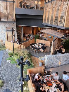 an overhead view of people sitting at tables in a restaurant