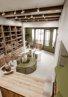 a living room filled with furniture and lots of shelves