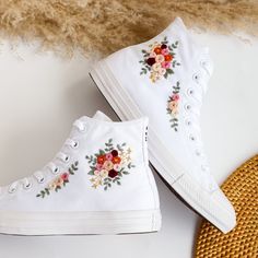 '' Custom Sneakers High Tops Embroidered Wedding Flowers, Rose, Bridal Flower, Personalized Bridal Sneaker '' 🍀 Price includes Converse Shoes and Floral Embroidery Designs as shown 🍀 🍀 Shoe Type: Converse  🍀 Shoe color: Full White 1. DETAILS 🍀 You can send me your Converse, Vans, canvas shoes or I can buy them for you. Custom-ordered embroidered Vans and Converse shoes, please wait another 2-4 days. Each pair is hand embroidered to order, please make sure you put in the correct shoe size before you check out. The embroidery is meticulous and does not fade. 🍀 You will receive Vans and Converse shoes with floral embroidery designs as above. 2. PERSONAL EXPRESSION 🍀 Create your unique vibe by your own design of embroidery! In addition to the embroidery patterns I post, I am happy to re White Embroidered Closed Toe Wedding Shoes, White Wedding Sneakers With Custom Embroidery, Wedding Low-top Sneakers With Floral Embroidery, White Wedding Sneakers For Summer, Spring Wedding Embroidered Sneakers, Spring Wedding High-top Sneakers, Embroidered Sneakers For Wedding, Embroidered Shoes Converse, Cute Converse Shoes