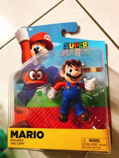 the mario action figure is in its package