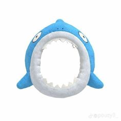 a blue and white stuffed shark toy with its mouth open to bite it's teeth