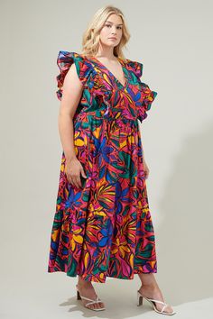 Get groovin' in the Rainbow Tropics Fairness Poplin Surplice Midi Dress! Breathable cotton works to shape a flowy midi dress. A deep V neckline is framed by ruffle details that act as an extended shoulder and trail down to the waistline. An effortless midi skirt maintains an A line silhouette with a single ruffle tier. Wear it with strappy heels and gold accessories to complete the look.- Surplice- Button snap- Breathable- Poplin- Color: Red MultiSize + Fit - Model is 5'9" and wearing size 2X- M Vibrant V-neck Midi Dress With Vibrant Print, Cotton V-neck Dress With Vibrant Print, Multicolor Cotton V-neck Maxi Dress, Vibrant Print Cotton V-neck Dress, Vibrant Print V-neck Cotton Dress, Flowy Midi Dress, Strappy Heels, Midi Skirt, Fitness Models