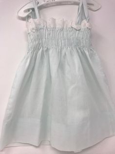 "Vintage pillowcase style dress/shoulder strings 13\" in length /dress length-top to bottom 13 1/2\" including eyelet trim with a 3\" hem available /Pitt to pit 8 1/2\" to 9\"/no issues very little stretches available through chest/smoke free environment/no issues other than age(137)" Cute Sundress With Smocked Back For Garden Party, Cute Smocked Summer Dress With Smocked Cuffs, Cute White Smocked Dress For Daywear, Smock Dress For Baptism In Summer, White Smocked Dress For Baptism In Summer, Cute Fitted Smocked Dress For Daywear, Cute Smocked Summer Dress, White Smocked Dress With Ruffled Straps For Daywear, Fitted Smocked Dress With Lace Trim For Summer