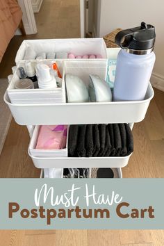 an organized cart with lots of items in it and the words must have postpartum cart