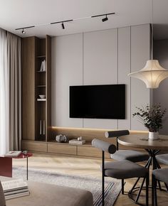 a living room filled with furniture and a flat screen tv mounted to the side of a wall