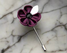 Elevate your style game and add a touch of sophistication to any outfit with this exquisite men's lapel flower. Made from the finest materials and crafted with the utmost care and attention to detail, this accessory is the perfect finishing touch to your attire. With its striking color and intricate design, this lapel flower is a statement piece that is sure to catch the eye of anyone who sees it. The bright, bold hues are perfect for adding a pop of color to a monochrome outfit, while the subtl Elegant Flower Shaped Lapel Pin For Gift, Elegant Flower Lapel Pin For Gift, Elegant Formal Brooches With Handmade Flowers, Elegant Handmade Flower Pins For Gifts, Elegant Handmade Flower Pins As Gift, Elegant Flower Decoration Lapel Pin As Gift, Elegant Floral Brooch For Formal Occasions, Elegant Flower Decorated Pins For Gifts, Elegant Flower Decorated Pins As Gifts