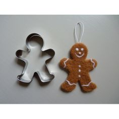 two cookie cutters shaped like ginger and a gingerbread man