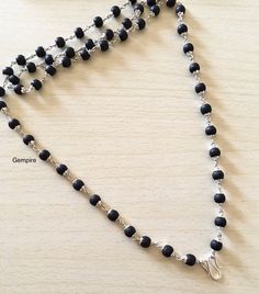 "Sterling Silver Tulsi Mala Necklace made using Sacred Tulsi Wood Beads (Colored Black). This beaded necklace can be worn by men as well as women. This Mala can be worn in multiple ways, it can be worn as it is, or you can attach a pendant/tassel in the lock of this Mala to wear it as a pendant necklace. Tulsi beads are made from Tulsi (Holy Basil) plant wood, considered as most sacred in India. Tulsi plant is worshipped in India and the food offered to Indian Gods is incomplete without the offe Krishna Black, Tulsi Mala, Tulsi Plant, Sandalwood Mala, Rudraksha Mala, Basil Plant, Beads Pictures, Holy Basil, Wood Bead Necklace