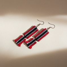 $10 off when you purchase 4 of our earrings (mix and match to have all your favorite designs and colors). Apply the promo code BUNDLE4 at checkout. Make a style statement wearing these unique Earn Your Stripes Inabel Earrings! Made with Cordillera cloth crafted by highly-skilled traditional Cordillera weavers, these lightweight works of art are sure to elevate any look with their vibrant colors, intricate patterns, and undeniable charm. Ready to stand out in the crowd? Get these earrings and make your mark! Details Size: 3.10 in. (from top of hook) Weight: 0.01 oz. Material: Cotton, Stainless Steel Earring Hook Product Story The earrings we proudly present to you originate from the breathtaking Cordillera Region, nestled in the heart of the Philippines and home to the renowned summer capit Red Bohemian Rectangular Earrings, Bohemian Red Rectangular Earrings, Filipino Heritage, Product Story, Earring Hook, Dangling Earrings, Make Your Mark, Ethnic Jewelry, Stainless Steel Earrings