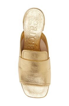 A loafer-inspired topline lends timeless sophistication to a metallic leather slide sandal balanced by a squared-off toe and low block heel. 2 1/2" heel ( size 38.5) Cushioned footbed with arch support Leather upper, lining and sole Made in Spain Gold Mules With Leather Sole For Summer, Chic Gold Sandals With Leather Sole, Gold Sandals With Sculpted Heel And Almond Toe, Classic Gold Almond Toe Sandals, Gold Leather Mules For Spring, Classic Gold Leather Sandals, Gold Mules With Stacked Heel For Spring, Classic Gold Mules For Spring, Gold Leather Mules For Evening