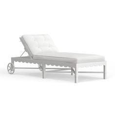 a white chaise lounge chair with wheels on it