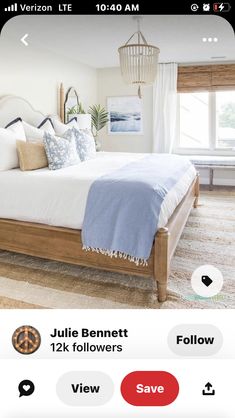 a bed with pillows and blankets on top of it