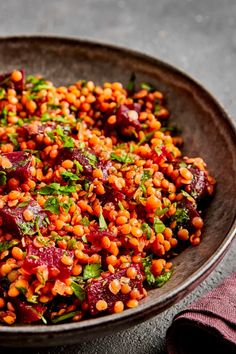 a bowl filled with food sitting on top of a table