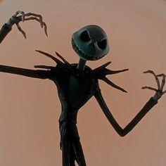 an animated skeleton with arms and legs spread out in front of a pink sky background