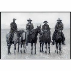 four men are riding horses in the snow