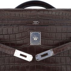 Guaranteed authentic Hermes coveted Kelly Depeches 36 briefcase bag featured in Matte Havane Porosus Crocodile.Laptop compartment and a rear interior wall zip pocket.Accentuated with Palladium hardware.Comes with sleeper and signature Hermes box.NEW or NEVER WORN.final saleBRIEFCASE MEASURES:LENGTH 36.6 cm / 14.4"TALL 29 cm / 11.41"DEEP 5 cm / 1.97"CONDITION:NEW or NEVER WORN TIDS 'n BITSThis new Kelly Depeches documents holder has sleek clean lines with beveled corners harkens to the constructi Luxury Briefcase With Silver-tone Hardware And Top Handle, Timeless Business Bag With Crocodile Pattern, Timeless Crocodile Pattern Business Bag, High-end Business Bag With Crocodile Pattern, Classic Briefcase With Silver-tone Hardware, Luxury Satchel Briefcase With Silver-tone Hardware, Classic Rectangular Briefcase With Silver-tone Hardware, Classic Formal Briefcase With Silver-tone Hardware, Luxury Brown Rectangular Briefcase