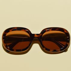 "Stay stylish and protected with these retro 60s-inspired sunglasses. The oversized lenses are polarized and the frame is made with acetate and TR90 for superior strength and comfort. The UV400 protective lenses are safe and durable, and the vintage style design will have you looking timeless. Approximate measurements:  5.78 inches x 2 inches  Lens height: 1.6\"	in stock	25.90 USD	"	4.00 USD	Accessories > Sunglasses & Eyewear > Sunglasses
https://i.etsystatic.com/5795811/r/il/87bbff/5066527921/i Retro Sunglasses With Tinted Lenses For Vacation, Retro Polarized Sunglasses For Vacation, Retro Shield Sunglasses With Polarized Lenses, Vintage Polarized Sunglasses For Vacation, Retro Shield Sunglasses With Uva Protection For Vacation, Retro Shield Sunglasses With Uv Protection For Vacation, Retro Sunglasses With Uva Protection For Vacation, Retro Polarized Shield Sunglasses For Beach, Retro 60s