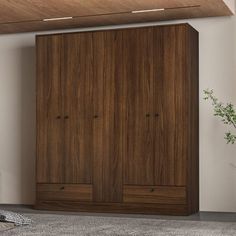 a large wooden cabinet sitting in the middle of a room