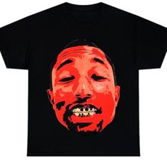 a black t - shirt with an image of a man's face