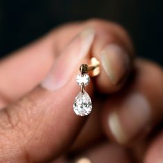 Mesmerizing dangling drops of pure brilliance. This lab grown diamond stud is crafted in solid 14k or 18k gold. The pear and round diamonds are drilled and hang delicately from the gold stud. A must-have for every piercing lover, this is a very versatile piece for your ear piercings! *  Gold: 14k / 18k Solid Gold  *  Gold Colour: Yellow / Rose / White  *  Gemstone: Lab grown Diamonds *  Diamond 1 Shape: Round Brilliant Cut  *  Round Diamond Wt.: ~0.08-0.10 Ct *  Round Diamond Size: ~2.7mm *  Dia Wedding Drop Diamond Earrings With Single Cut Diamonds, Wedding Drop Diamond Earrings With Single Cut, Lab Grown Diamond Teardrop Jewelry In Prong Setting, Lab-grown Diamond Teardrop Jewelry In Prong Setting, Teardrop Lab Grown Diamond Jewelry With Prong Setting, Teardrop Lab-grown Diamond Jewelry With Prong Setting, 14k Gold Pear-shaped Jewelry With Rose Cut Diamonds, Lab Grown Diamond Teardrop Jewelry With Diamond Cut, Teardrop Lab Grown Diamond Jewelry With Vvs Clarity