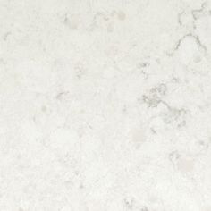 a white marble counter top textured with light gray and dark grey speckles