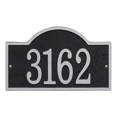 a black and white address sign with the number 2162 on it's side