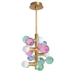 a gold chandelier with multi - colored glass balls hanging from it's center