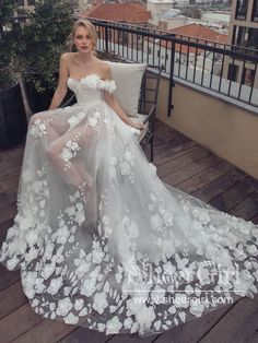 a woman in a white dress sitting on a chair with flowers all over her body