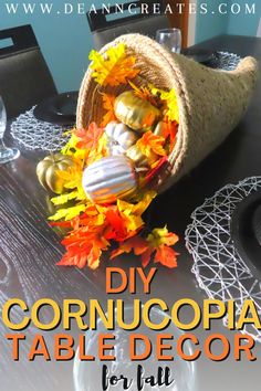 a cornucopia table decoration with fall leaves on it and the words diy cornucopia table decor for fall