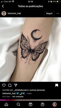 a black and white photo of a butterfly with a crescent moon tattoo on it's leg