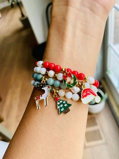 These handmade Christmas holiday charm beaded bracelets come in several different colors and charms. You can mix and match the colors and charms in any way you'd like!  You can choose from these different holiday charms: - Wreath - Christmas Tree - Santa Hat - Reindeer  Indicate what kind of charm and color in the personalization box.  Please make sure to measure your wrist ahead of time so that you know what size to order. These bracelets are made on an elastic type string. The gold beads are s Word Beaded Bracelets, Navidad Aesthetic, Word Bracelets, Christmas Jewelry Diy, Cameo Crafts, Handmade Charm Bracelets, Bracelet Party, Holiday Bracelets, Preppy Bracelets