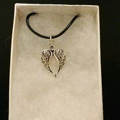 Handmade Angel Wings Necklace Made With Silver Angel Wings On Black Cord Chain. Pendant Angel Wings Measure 18mm In Antique Silver. Angel Wings Are A Symbol Of Love And Protection. Chain Is Adjustable With Claw Clasp Closure. Box Display Only. Pouch Included Free. New And Unused Item. Contact Me With Any Offers. Silver Metal Necklace For Memorial, Silver Memorial Necklace, Silver Metal Memorial Necklace, Nickel Free Silver Jewelry For Memorial, Nickel-free Silver Jewelry For Memorial, Silver Charm Necklaces For Memorial, Adjustable Silver Necklace For Memorial, Nickel Free Silver Necklace For Memorial, Silver Nickel-free Necklace For Memorial