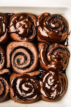 chocolate cinnamon rolls in a white baking dish